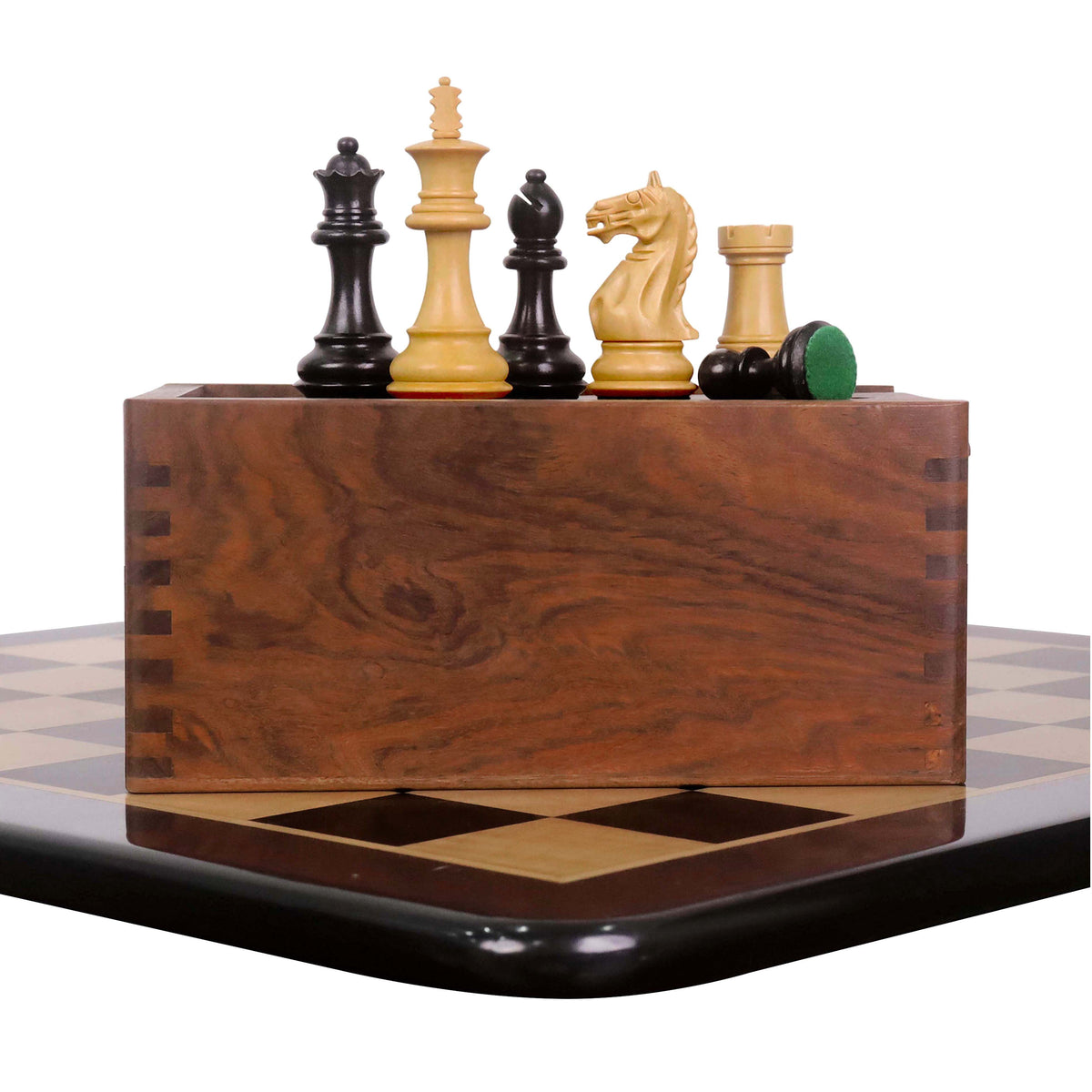 Fierce Knight Staunton set pieces (King, Queen, Rook, Knight, Bishop, Pawn) and closed storage box on a chessboard.
