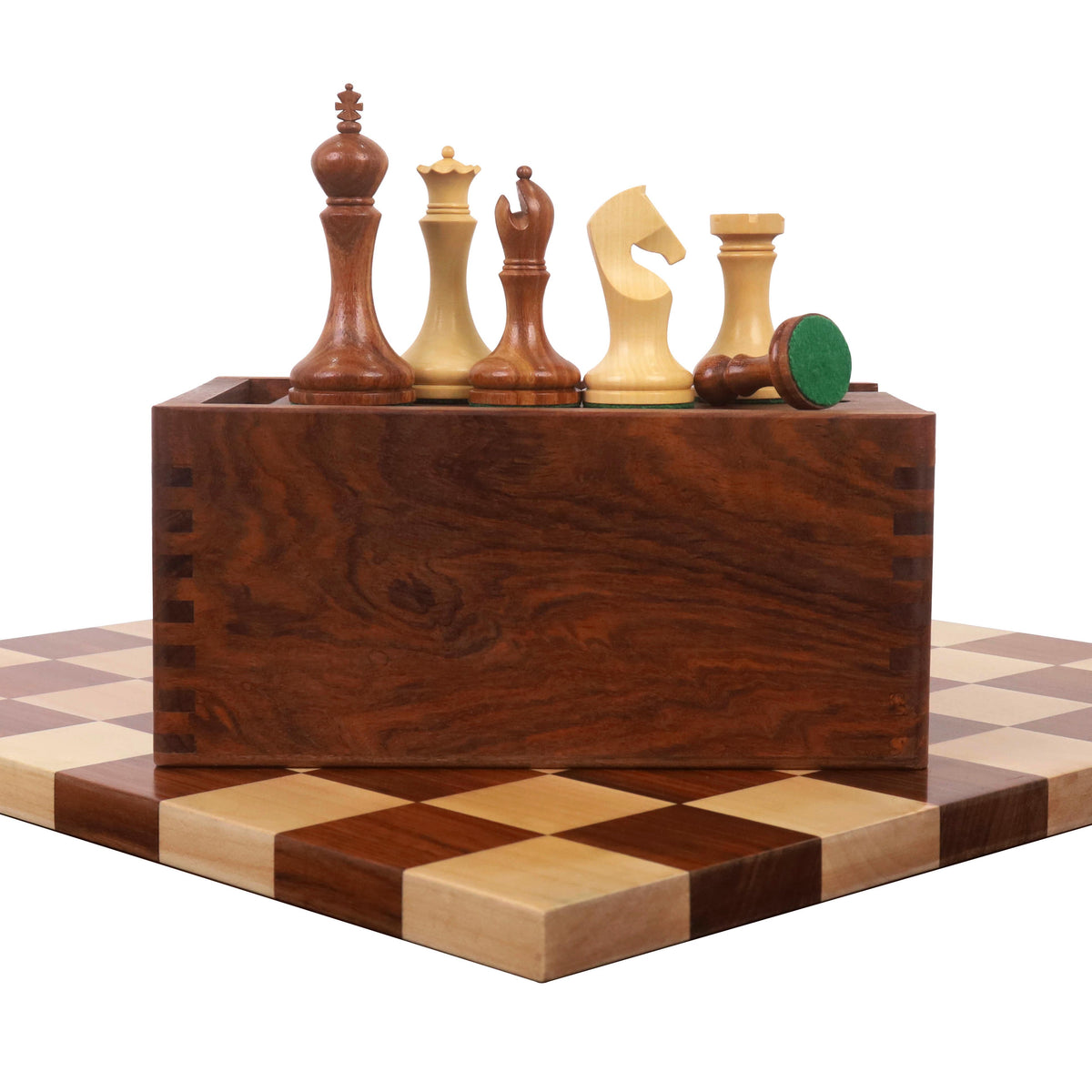 Zadar series minimalist chess set featuring golden rosewood and boxwood pieces balanced on a slide-top wooden box.