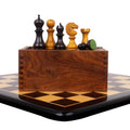 Handcrafted English Dublin chess pieces displayed on a wooden storage box and board.