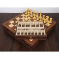 Wooden chess storage drawer with dedicated velvet-lined compartments for Staunton chess pieces.
