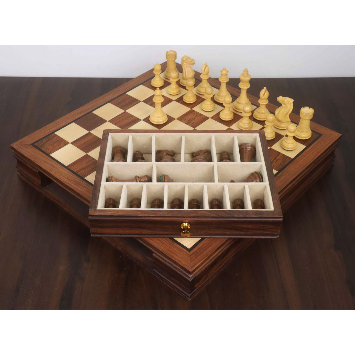 Wooden chess storage drawer with dedicated velvet-lined compartments for Staunton chess pieces.