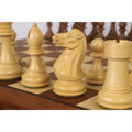 Detailed view of the hand-carved white Staunton chess knight on a golden rosewood board.