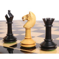 Boxwood knight standing between an ebonised bishop and rook from the 3.5-inch Monolith miniature chess set.