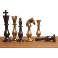 Gold and metallic grey brass chess pieces from the Regal Curve Series.