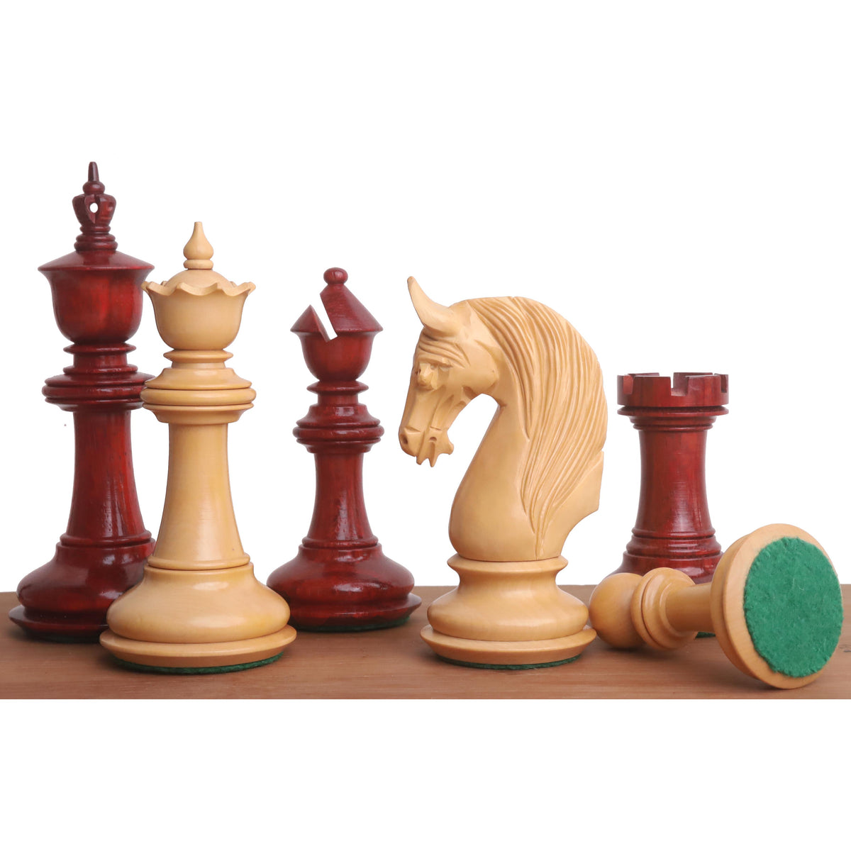 4.6 inch Bath luxury Staunton chess pieces in bud rosewood and boxwood with green felt bases.