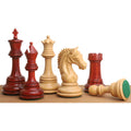 Bud Rosewood and Boxwood Staunton chess pieces lined up on a wooden surface.