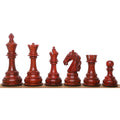 Six handcrafted rare Columbian bud rosewood luxury chess pieces arranged linearly.