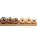 Recessed bases of Golden Rosewood and Boxwood chess pieces designed for Chessnut Air sensor compatibility.