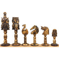 Six carved animal kingdom chess pieces in distressed antiqued camel bone finish showing meticulous details.