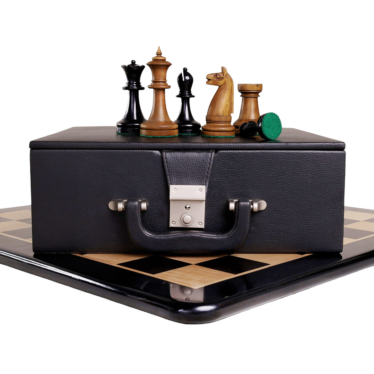 Antiqued boxwood chess pieces displayed on a premium leatherette storage coffer.
