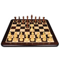 Full chess set in starting position on the rosewood and maple chess board.