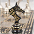 Detailed view of a black Soviet-inspired brass knight chess piece.