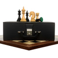 Hand-carved 4.4" Dragon Staunton chess pieces displayed on a storage box and board.