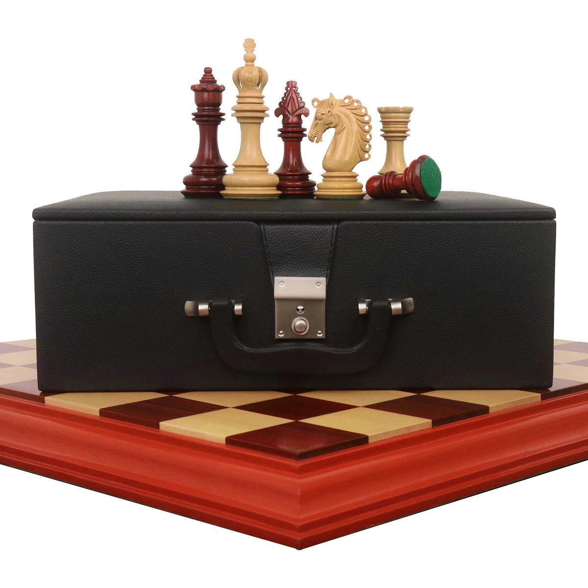 4.5-inch Carvers' Art luxury chess set in budrose wood with storage box and board.