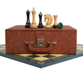 Luxury Avant Garde ebony chess pieces with storage box on a printed board.