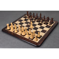 Complete 4-inch Fierce Knight Staunton chess set on a luxury board.