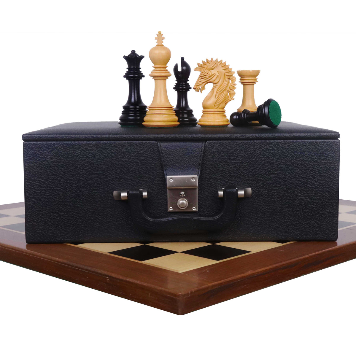 Mogul Staunton ebony chess pieces displayed with their luxury storage case on a chess board.