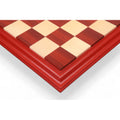 Top view of a 23 inch luxury chessboard featuring Bud Rosewood and Maple wood squares with a decorative carved border.