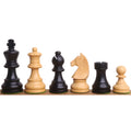 Black and white Staunton chess pieces arranged in a row.