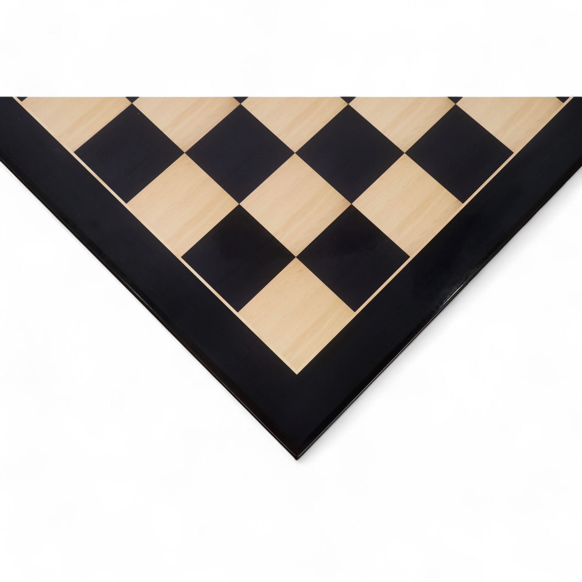 Close-up of a 26 inch ebony and maple wood printed chess board corner with a high-gloss finish.