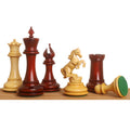 Incitatus luxury Staunton chess pieces in bud rosewood and boxwood standing in a line with a felt-base pawn.