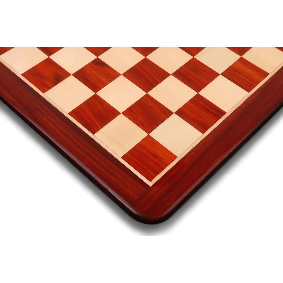 Close-up of the rounded corner and fine grain of a Bud Rosewood and Maple wooden chess board.