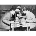 A historical photo of Tigran Petrosian and Paul Keres playing with the original Piatigorsky Cup chess set.