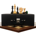 Prestige Luxury Staunton ebony chess pieces set up on a 23-inch ebony and maple wood chessboard.