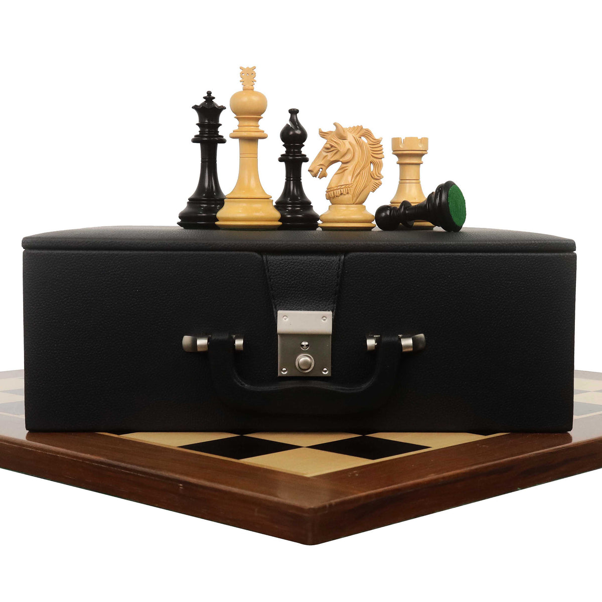 Prestige Luxury Staunton ebony chess pieces set up on a 23-inch ebony and maple wood chessboard.