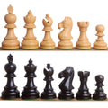 Lineup of light and dark ebonised boxwood Taj Mahal chess pieces.