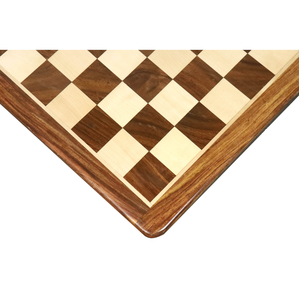 Close-up of a 21-inch golden rosewood and maple chess board corner showing natural wood grain.