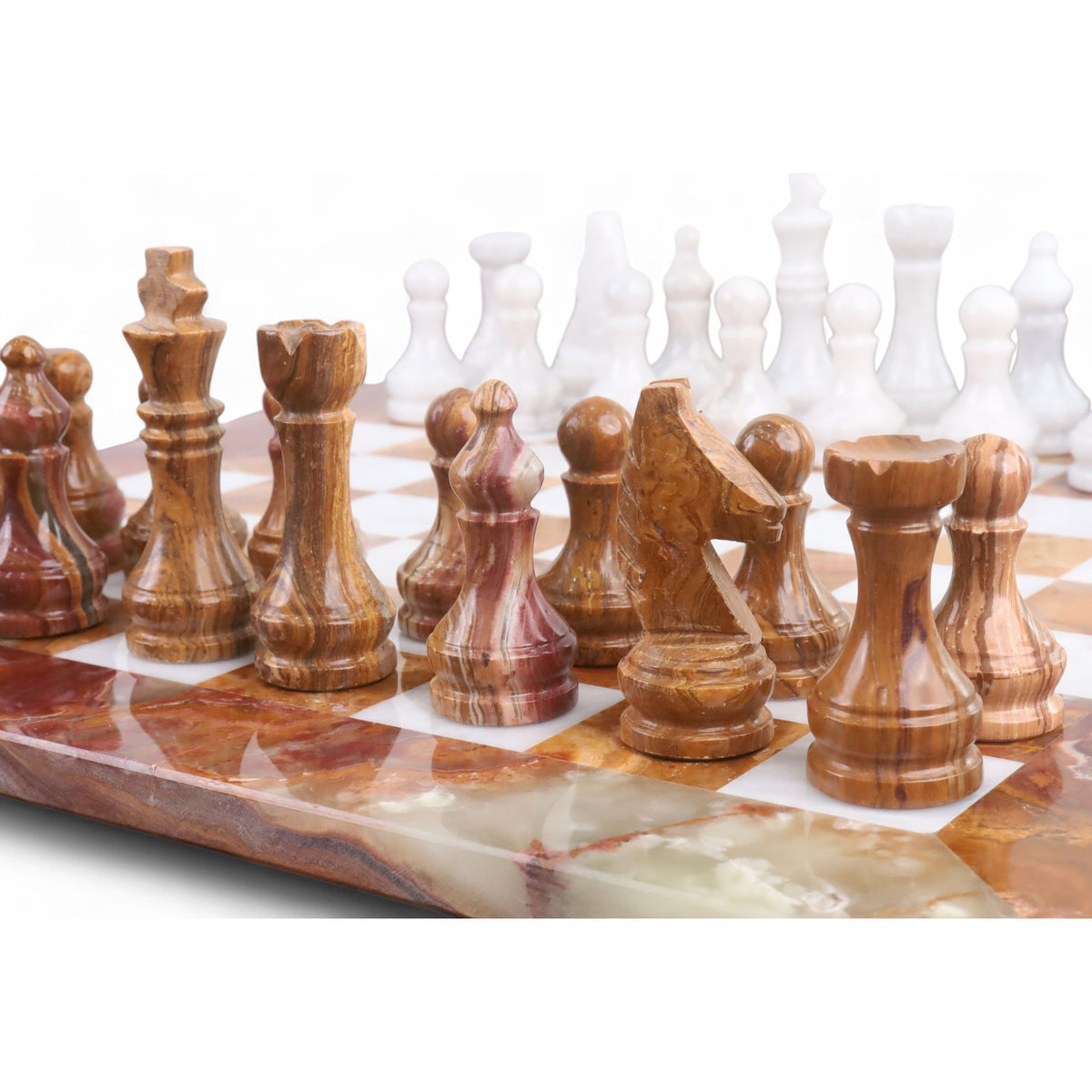 Close-up of brown onyx marble chess pieces with natural veining on a matching stone chessboard.