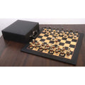 Complete 3.7" Victorian Fusion brass metal chess set arranged on a wooden board next to a black leatherette storage case.