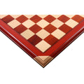 Close-up of 21 inch bud rosewood and maple luxury chessboard corner with raised tiles.
