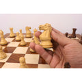 Detailed carving of a Boxwood Knight piece from the Monarch Series chess set.
