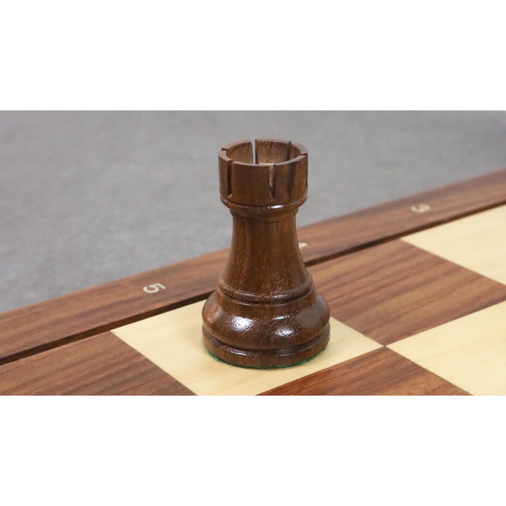 A sturdy Golden Rosewood Rook with classic 1972 Championship proportions on a wooden board.