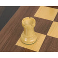 The complete dark army of the 1950s Fischer Dubrovnik set in mahogany stained boxwood, arranged for a product showcase.