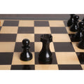 Close-up of black ebonised pawn and rook from the 3.6" English Dublin chess set on a wooden board.