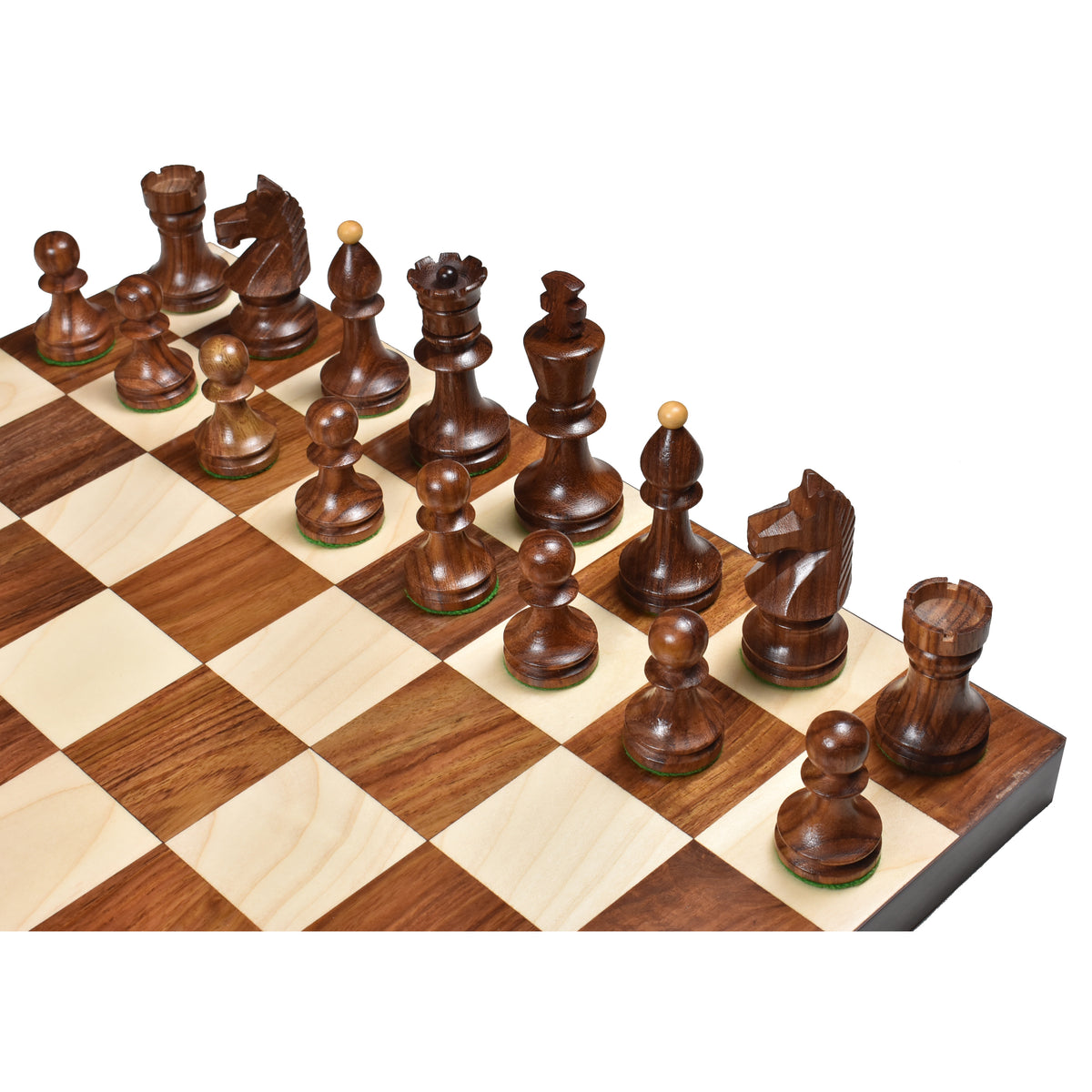 Overhead view of Romanian Hungarian golden rosewood chess pieces set up on a wooden board.