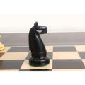 Isolated view of a black ebony wood knight chess piece.