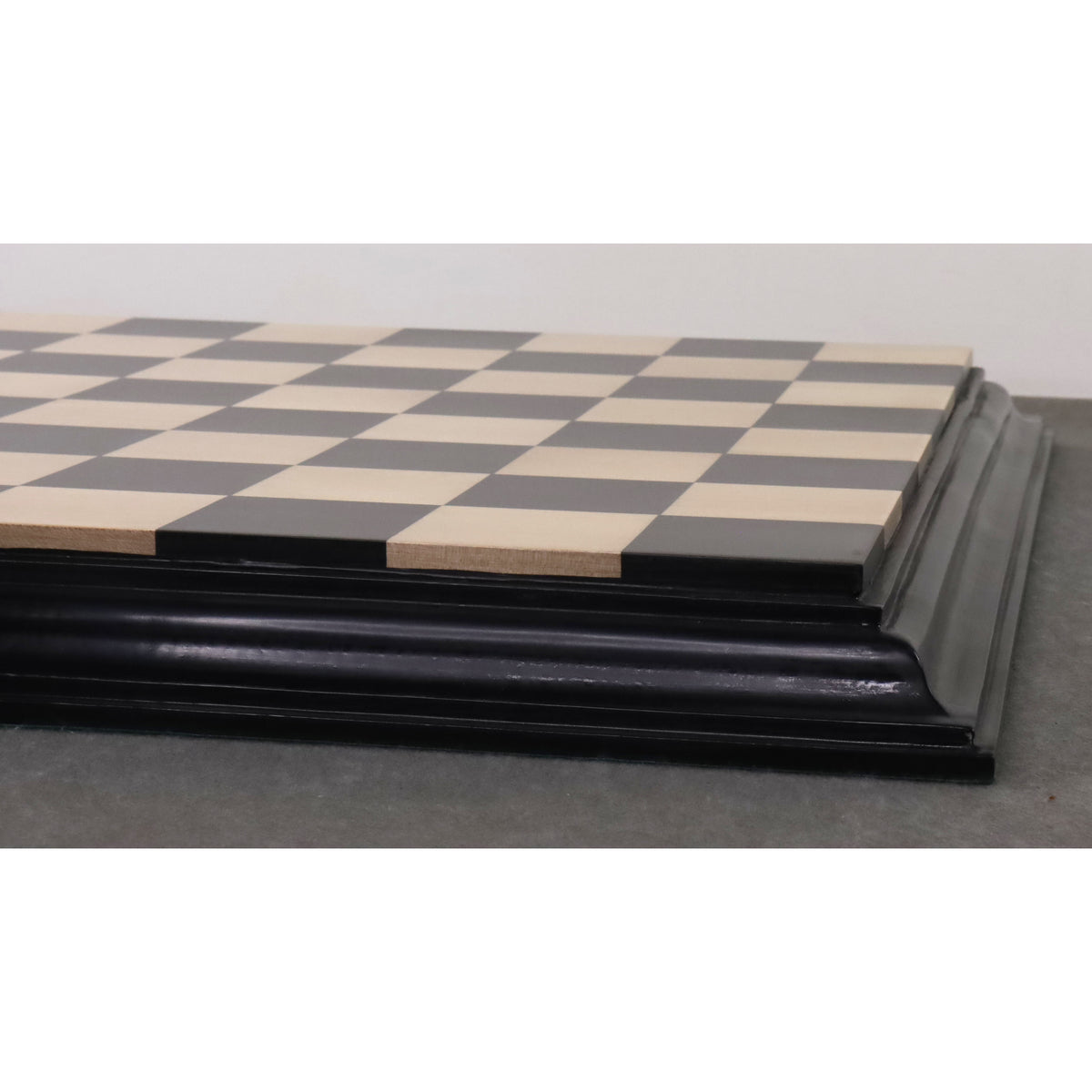 Detailed edge view of a premium wooden chess board.