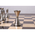 Detailed view of a metallic silver Tribal Series rook chess piece.
