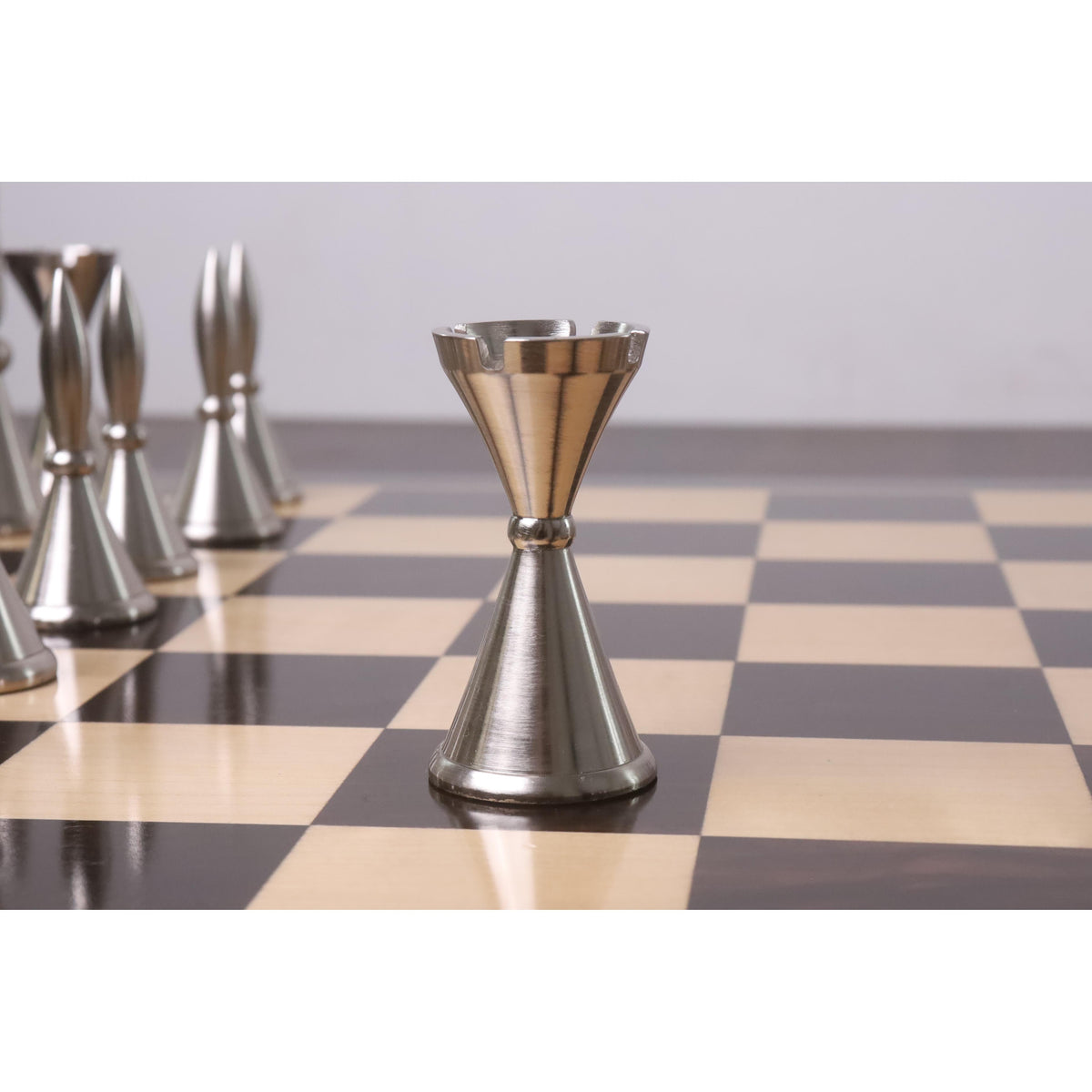 Detailed view of a metallic silver Tribal Series rook chess piece.
