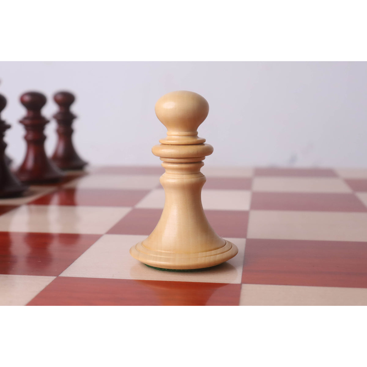 Single light Boxwood pawn from the Aristocrat luxury chess set.