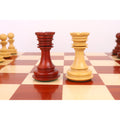 Detailed view of the red and light rooks in the 4.5-inch Carvers' Art luxury chess collection.