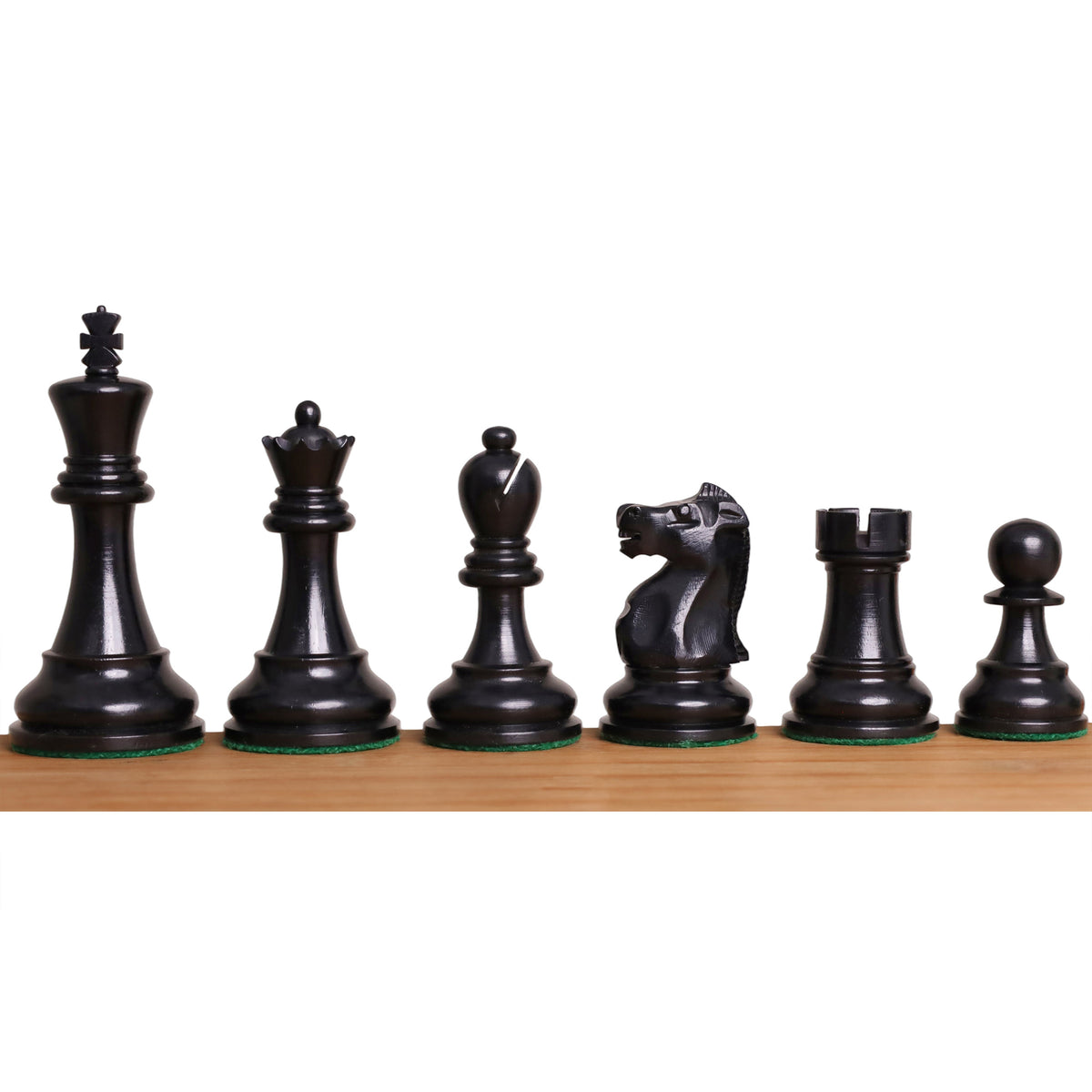 Profile view of the black chess pieces from the 1972 Fischer Spassky set.