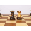 A side-by-side view of a dark and a light golden rosewood Staunton rook on a 20-inch legacy chess board.