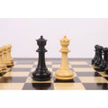 The light and dark wood Queen pieces from the 3.9" Heritage Series Staunton chess set are positioned centrally on a chessboard.