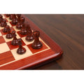 Close-up of a single Boxwood pawn from the Spiraled Steed luxury chess set on a board.