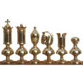 Complete set of gold brass luxury chess pieces from the Giant Victorian series arranged in a row.